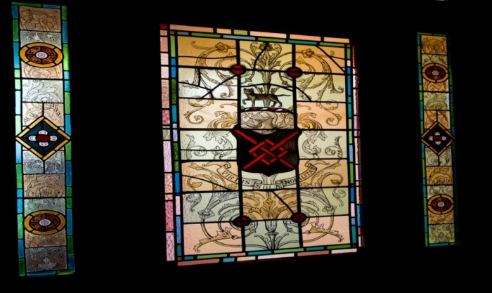 An interior view of Ballyglunin House, showing a stained glass with Blake coat of arms - similar to the obverse design on the Ballyglunin (Truck) Tokens