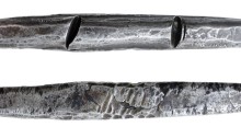 A 'cast' Viking Silver Trade Ingot, c. 800-1000 AD – a sub-rectangular in plan and ovate in section, and tapering to a rounded point at each end. The Old Currency Exchange, Dublin, Ireland.