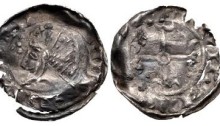 An Hiberno-Norse, Phase V, Class B Silver Penny. Draped bust left with quatrefoil before. Voided short cross with annulet center and triple crescent ends. Uncertain mint signature and moneyer. 19mm. 0.45g