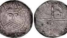 Hiberno-Norse. Phase IV. Circa 1055/60-1065. AR Penny (18mm, 0.63 g). ‘Scratched-Die’ coinage. Helmeted facing bust with triple-strand moustache; trefoil of pellets on chin / Voided long cross, with triple crescent ends; double pellets, quatrefoil of pellets, ‘hand’ and ‘+’ in quarters. O'S 47 var. (symbols in rev. field); SCBI 8 (BM), 152/145 (same obv./rev. dies); SCBC 6136. Toned. VF. Rare.